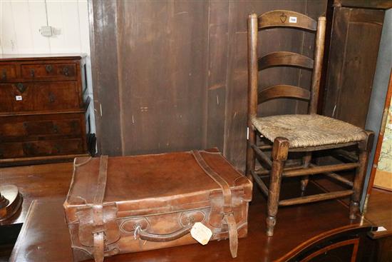 Ladderback chair and leather suitcase
